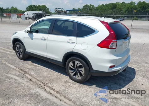 2016 Honda Cr-V Touring z USA, uszkodzony, nr VIN 5J6RM4H95GL118070